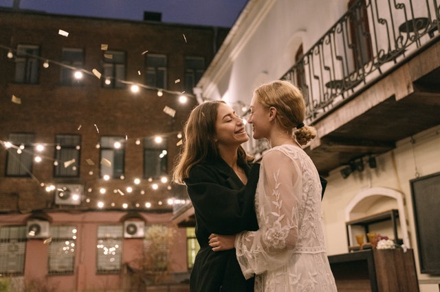 Female couple dancing on an evening of celebration