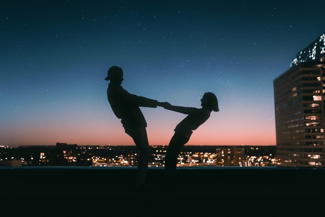Couple on rooftop at sunset