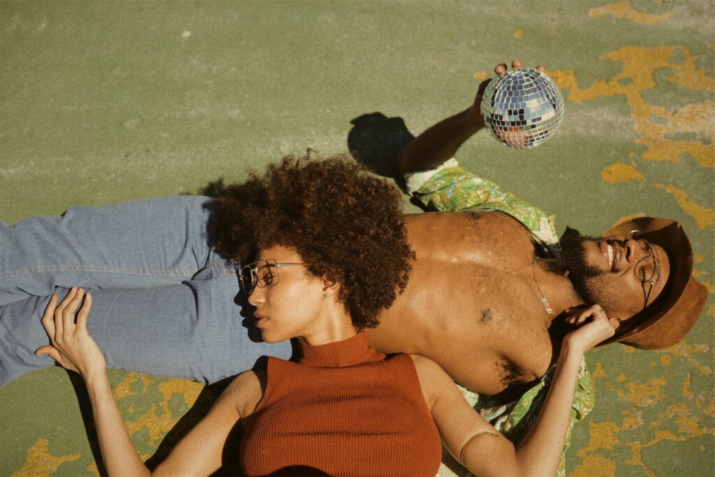 Woman resting her head on man's stomach