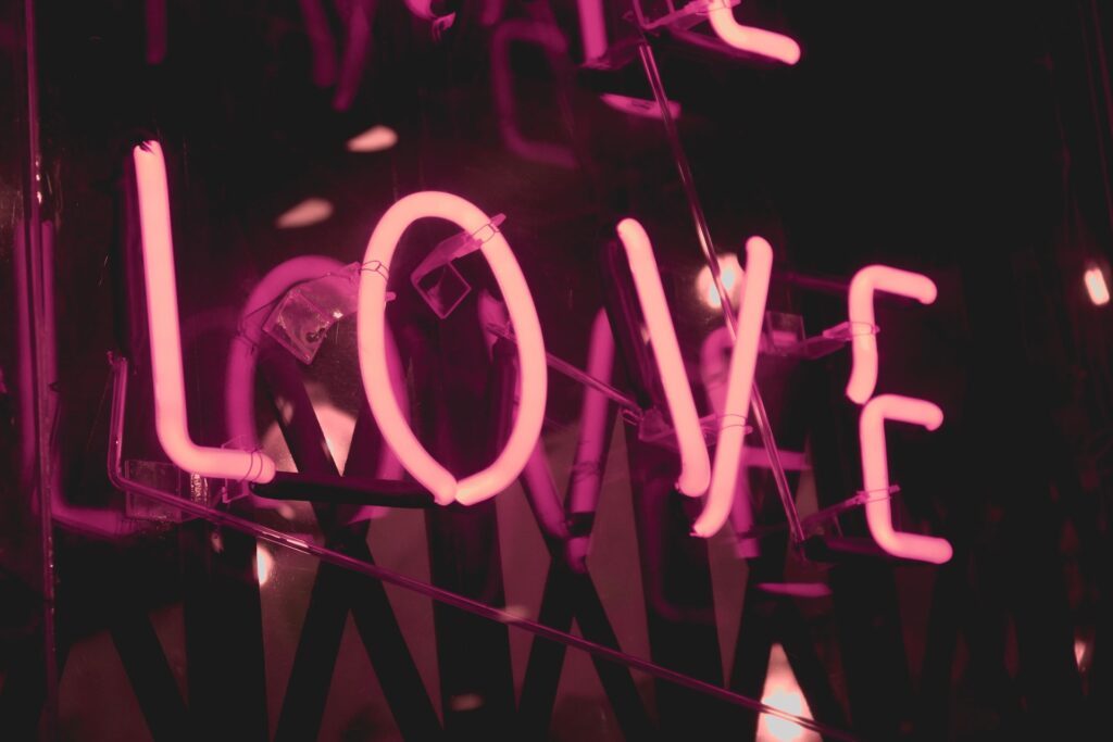 'Love' spelt out in neon glowing pink letters