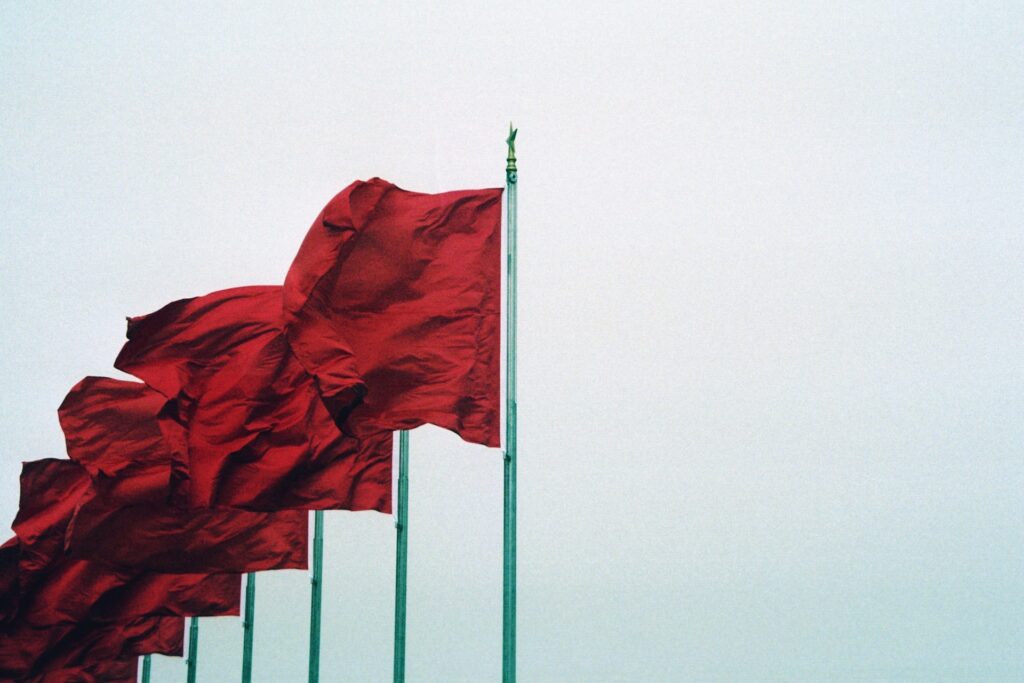 red flags waving in the wind